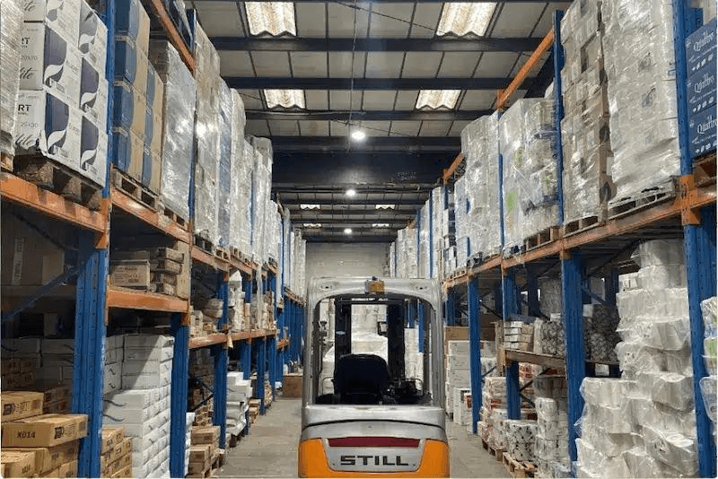 Warehouse aisle with palletized stock ready for replenishment